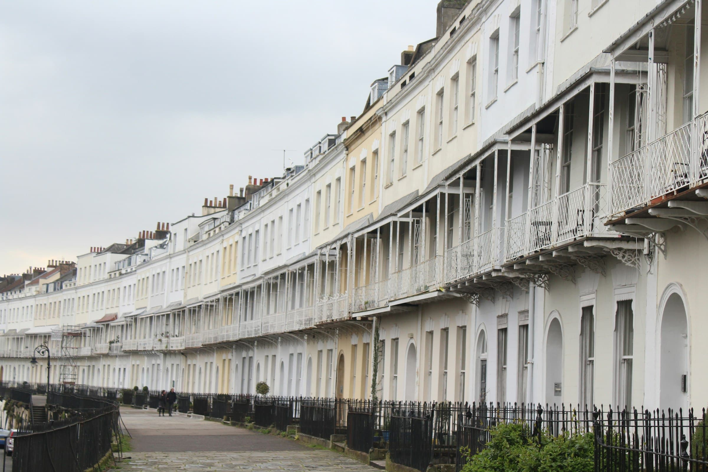 A row of elegant Georgian terraced houses on a residential crescent in Bristol, UK