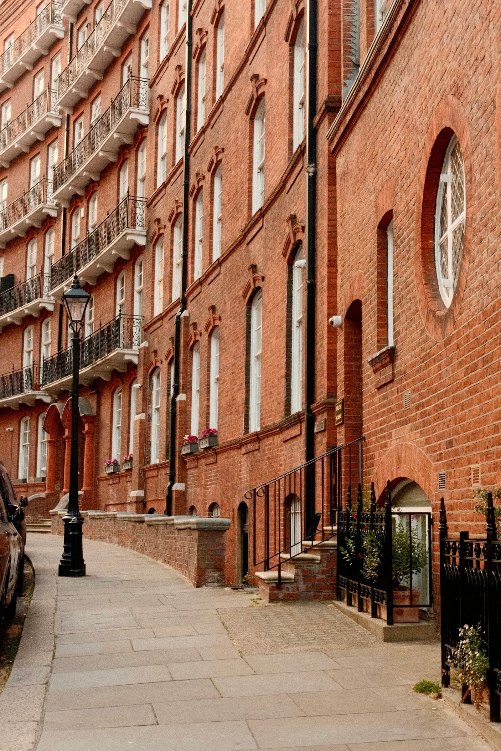 A red-brick residential building in Kensington, London