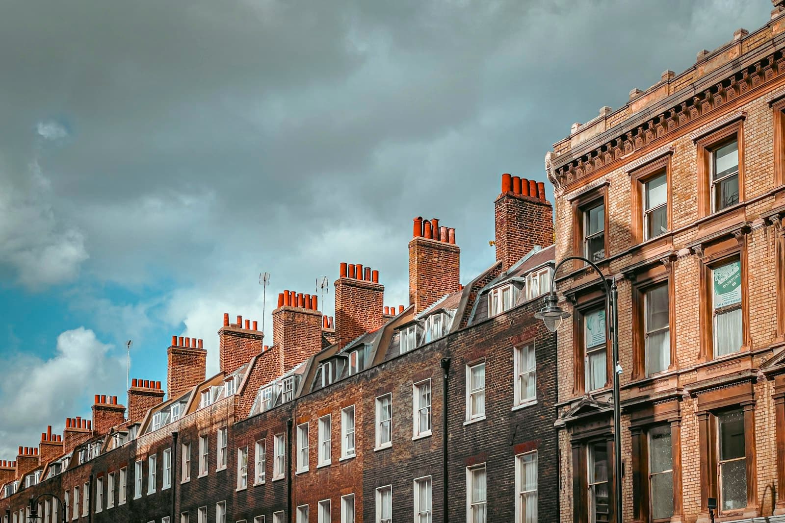 Rooftops and chimneys along a terraced street in London